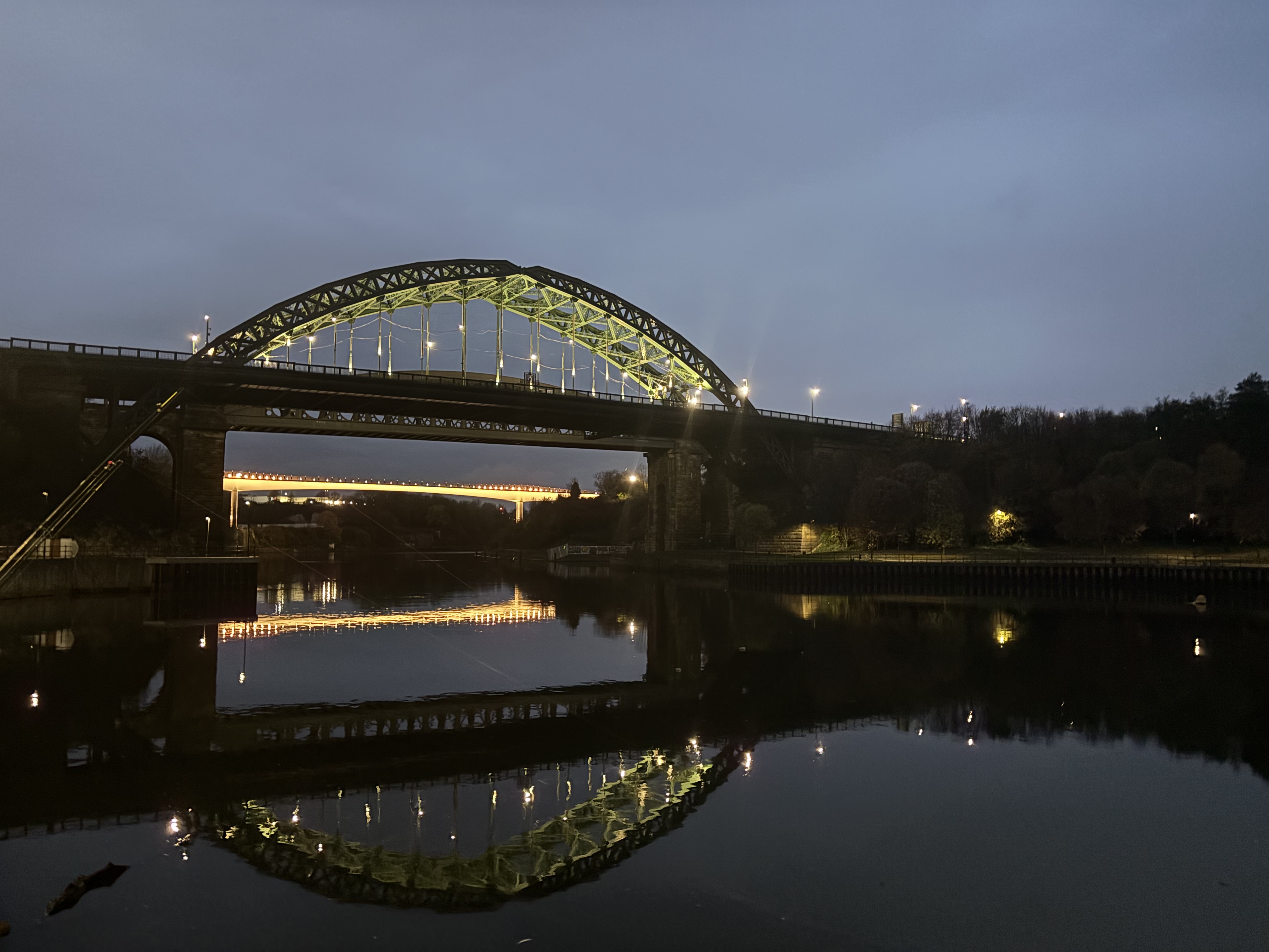Illuminated local bridge representing AJWAYS regional delivery coverage